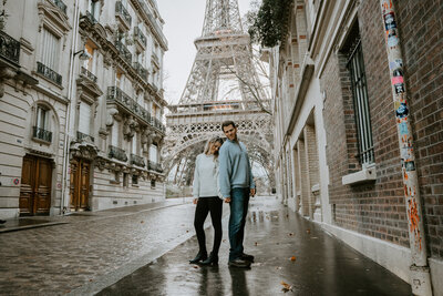 Couple taking photos in Pairs France on their multi day elopement at the Eiffel Tower