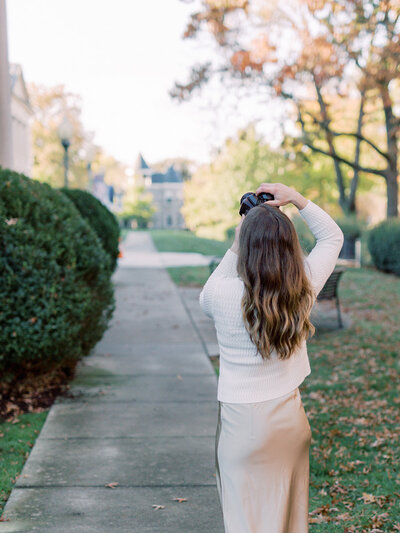 A photographer taking pictures of the scenery by Katie Stansfield Photography, a family photographer in Richmond.