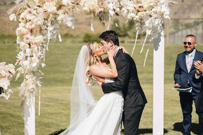 Couple Kissing at the End of Ceremony - Mikayla & Mario | Harmony Meadows Wedding - Lake Chelan Wedding