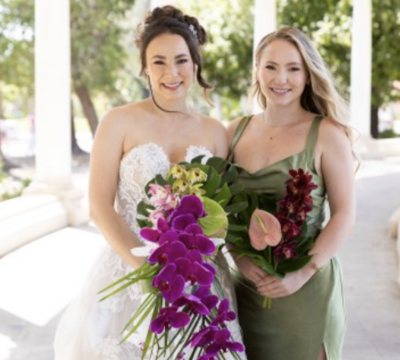 bride smiling with her bridesmaids