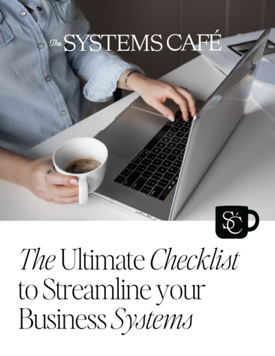 Michelle, founder of The Systems Café, leaning on a white staircase railing and smiling in a bright and inviting home setting, representing her approachable and organized approach to helping entrepreneurs streamline their business systems