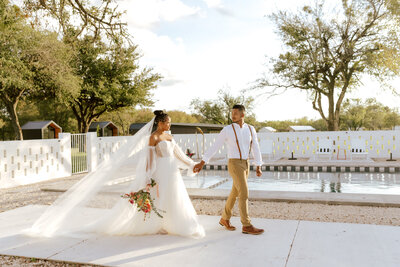 contigo ranch fredericksburg Wedding Venue Photographer. Austin Texas Wedding Photographer. Fun wedding photos. Bride and groom golden hour photos. Lace wedding dress. Maroon Grooms suit.  Fall wedding colors.