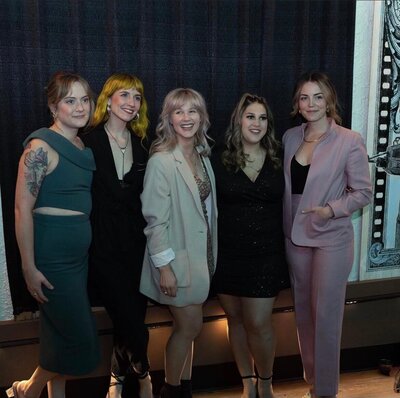 Indie film producer and actor Cassi Angier with film crew at a premier.