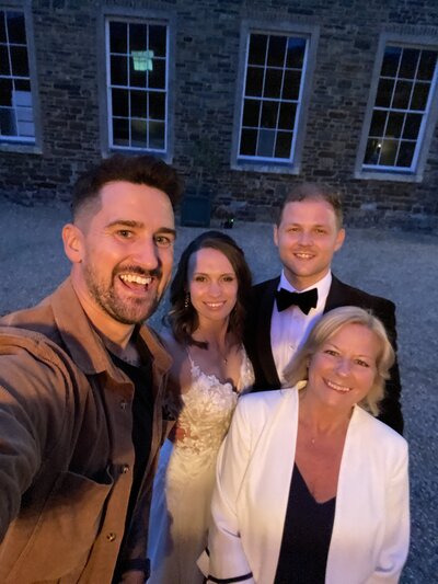 Amy & Nick posing with couple