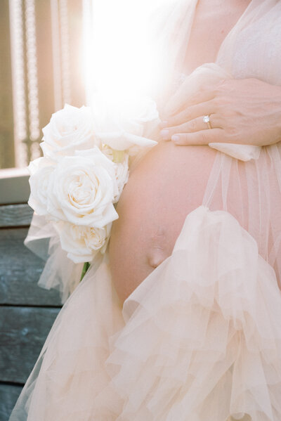 Baby bump with white florals in Ottawa