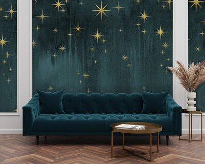 Teal couch in front of teal wall with glitter stars throughout