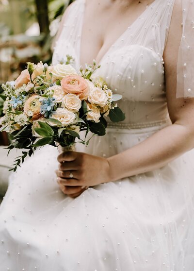 Bride holding beautiful bouquet