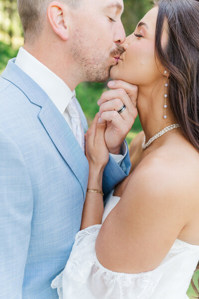 bride and groom at their barn at mader farm wedding in idaho
