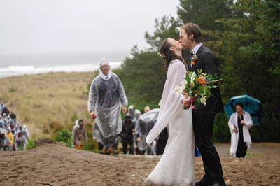 stylish bride and groom have intimate moment by columbia river gorge