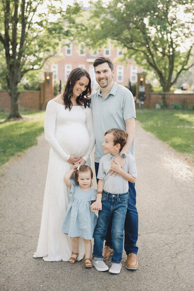 family standing together during maternity photos