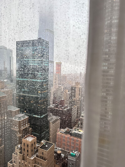 Downtown cityscape photo taken from hotel room on a rainy day