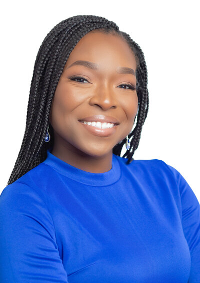 A professional headshot of a smiling woman with natural curly hair, captured by Atlanta Headshot Specialist Lynda Louis Photography