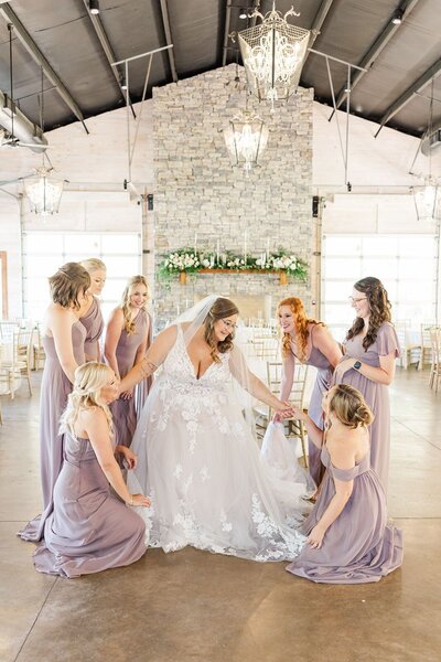 Bride surrounded by her bridesmaids