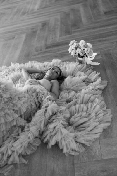 Bride photoshoot laying down the floor