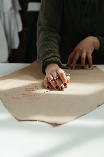 Artist confidently working on a painting, showcasing the benefits of overcoming self-doubt through creative coaching