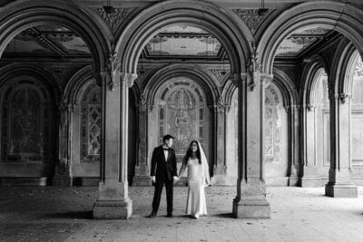 An Asian couple poses for wedding portraits in Central Park