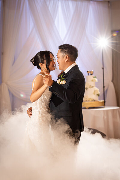 Bride and groom veil shot beneath towering redwood trees during their forest wedding in Santa Cruz, captured by Honey I Do