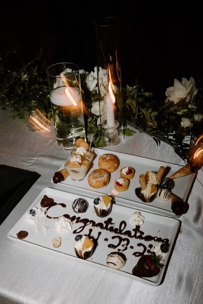 Two plates of mini desserts at a wedding reception 