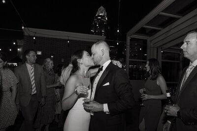 Bride and groom kiss at reception