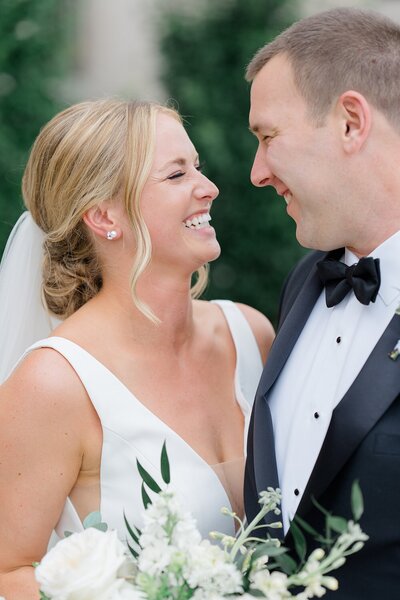 bride and groom kiss at the end of the aisle photographed by ohio wedding photographer ashleigh grzybowski