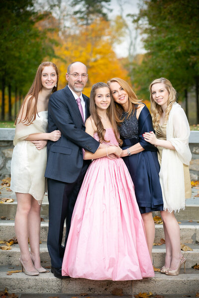 A family of five poses for a portrait at Temple Sharaay Tefila in Bedford NY