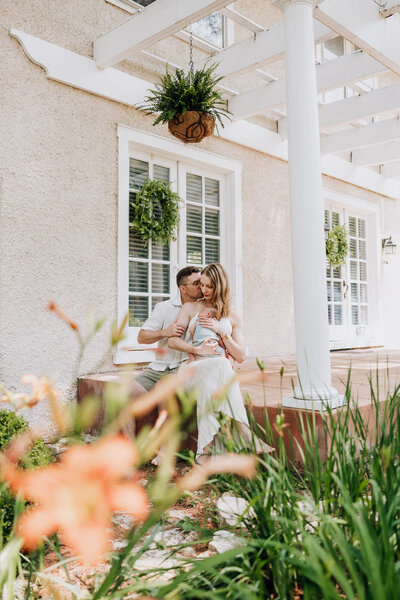 Newborn lifestyle portrait of family on their front porch taken by Jennifer Mosier Photography. 