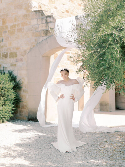 Bride posing outside in Italy