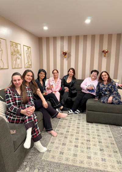 Close-up of gold and silver permanent jewelry chain options in display tray.