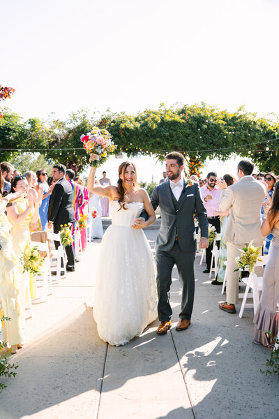 Groom kissing bride on her cheek