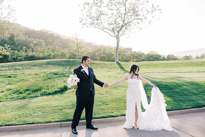 Bride and groom celebrating their wedding day at Eagle Ridge Golf Course in Gilroy, California, with lush fairways and rolling hills in the background.