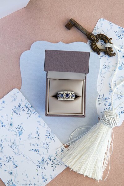 blue  diamond ring on blue stationery by Raleigh product photographer