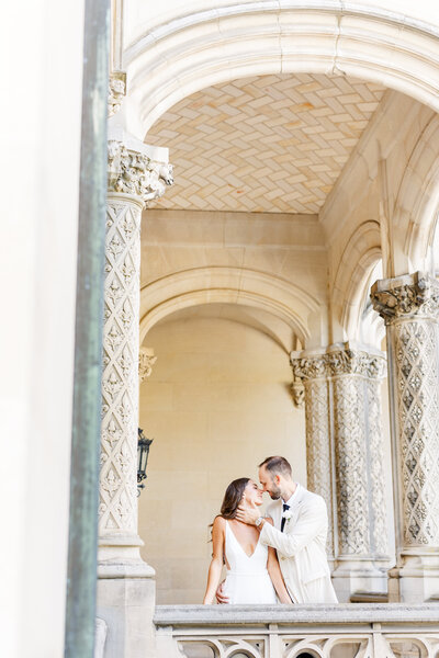 Bride & Groom embracing by the Biltmore house