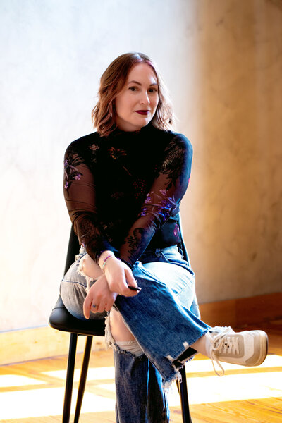woman sitting on stool