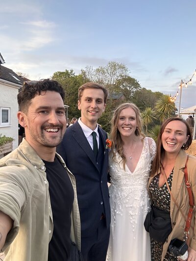 Amy & Nick posing with couple