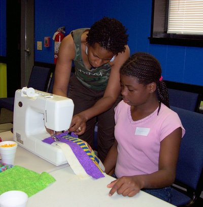 Sheri Bedsole - Roxanne instructing on sewing machine-1