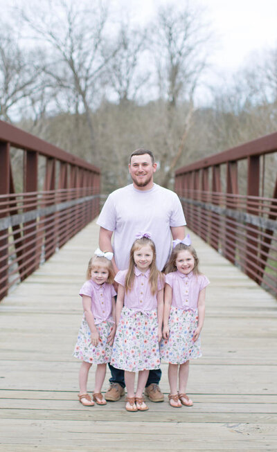 Dad and daughters at a park family photoshoot in St Augustine FL