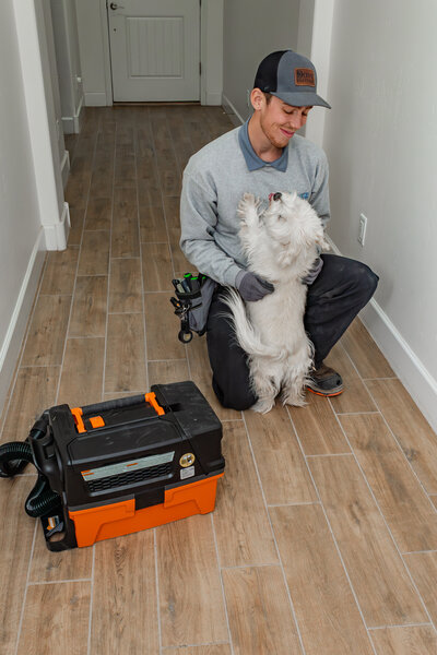 Dove Electric electrician in Albuquerque greeting dog in home