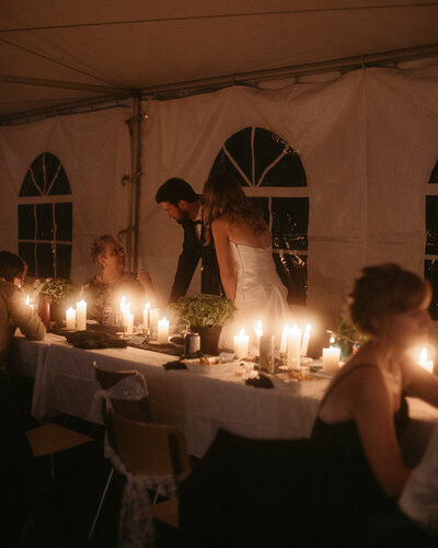 Couple at their wedding in Tisdale. Candlelit reception. 