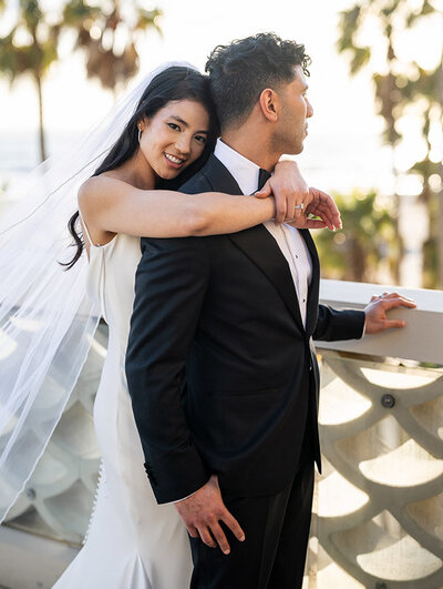 Editorial style portrait of a bride and groom on the rooftop of Casa Del Mar in Los Angeles by San Francisco Wedding Photographer Duy Ho