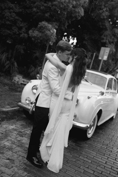 Bride and groom in front of vintage car, by orlando photographer