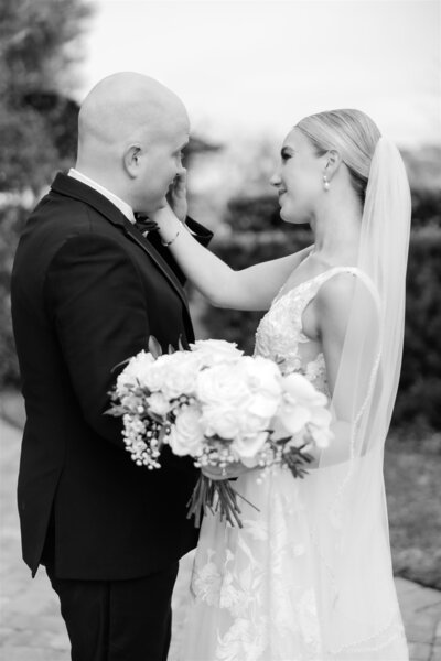 A sweet moment between bride and groom by Florida Wedding photographer 