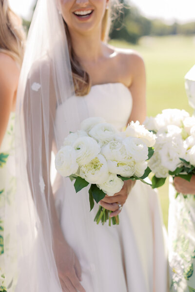 Bride and groom kiss at their grandfather country club wedding