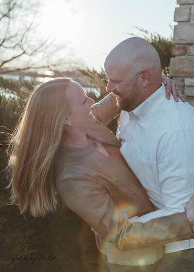 a couple hugging in a park in oshkosh