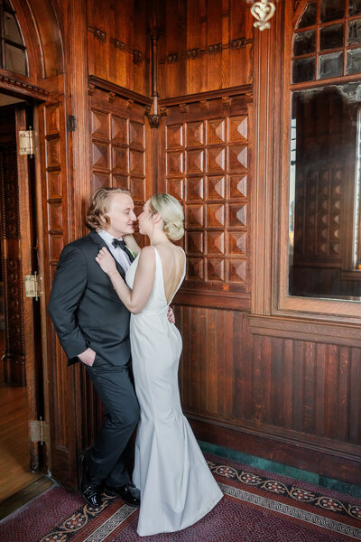 Georgia Wedding Photographer | Bride and Groom Snuggling in Foyer of Classy Atlanta Wedding Venue