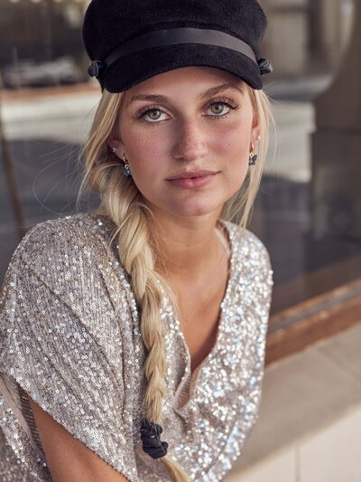 close up portrait  of a girl in a shinny sequin shirt