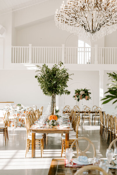 Detail photo of reception setup with flowers at Westwind Hills in Missouri, taken by St. Louis wedding photographer Jacoby Andrick