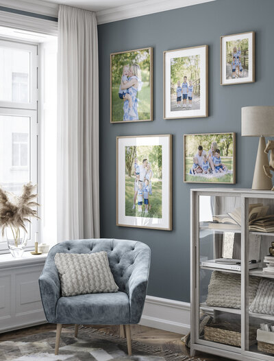 Bright and airy living room with a gallery wall of framed family portraits, showcasing how Kansas City photography can be displayed as home decor.