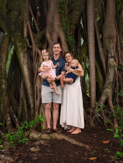 family standing in front of tree by st. louis photographer, sutherland photography