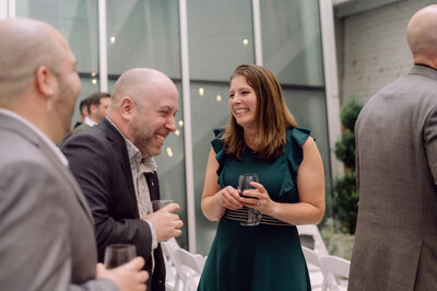 Guests and couple dancing during lively wedding reception at Quirk Hotel Richmond, captured in candid, film-inspired style.