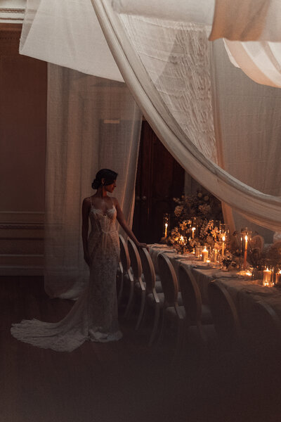 Wedding photographer captures couple taking a stroll hand in hand at their french chateau wedding.